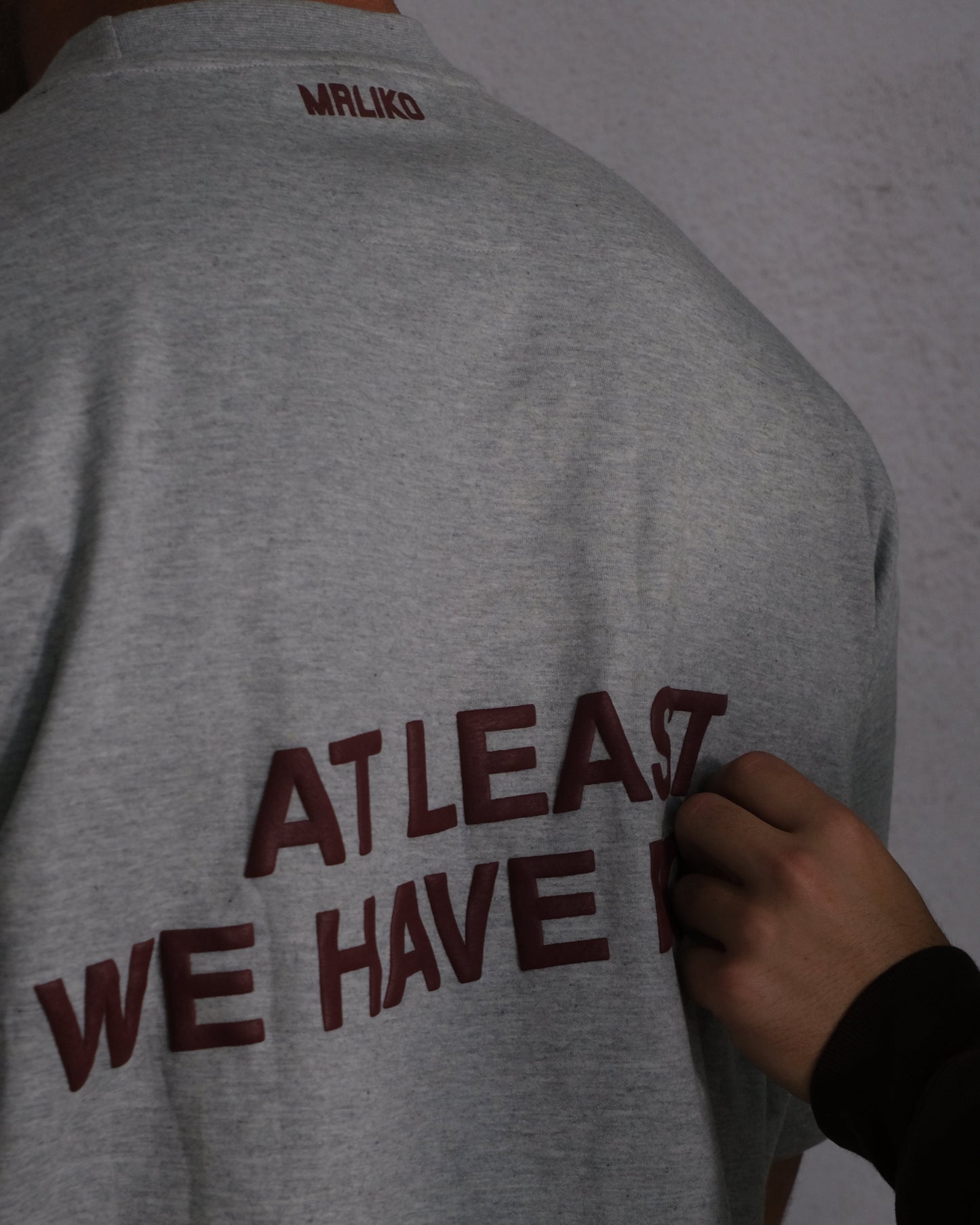 man wearing oversized t shirt