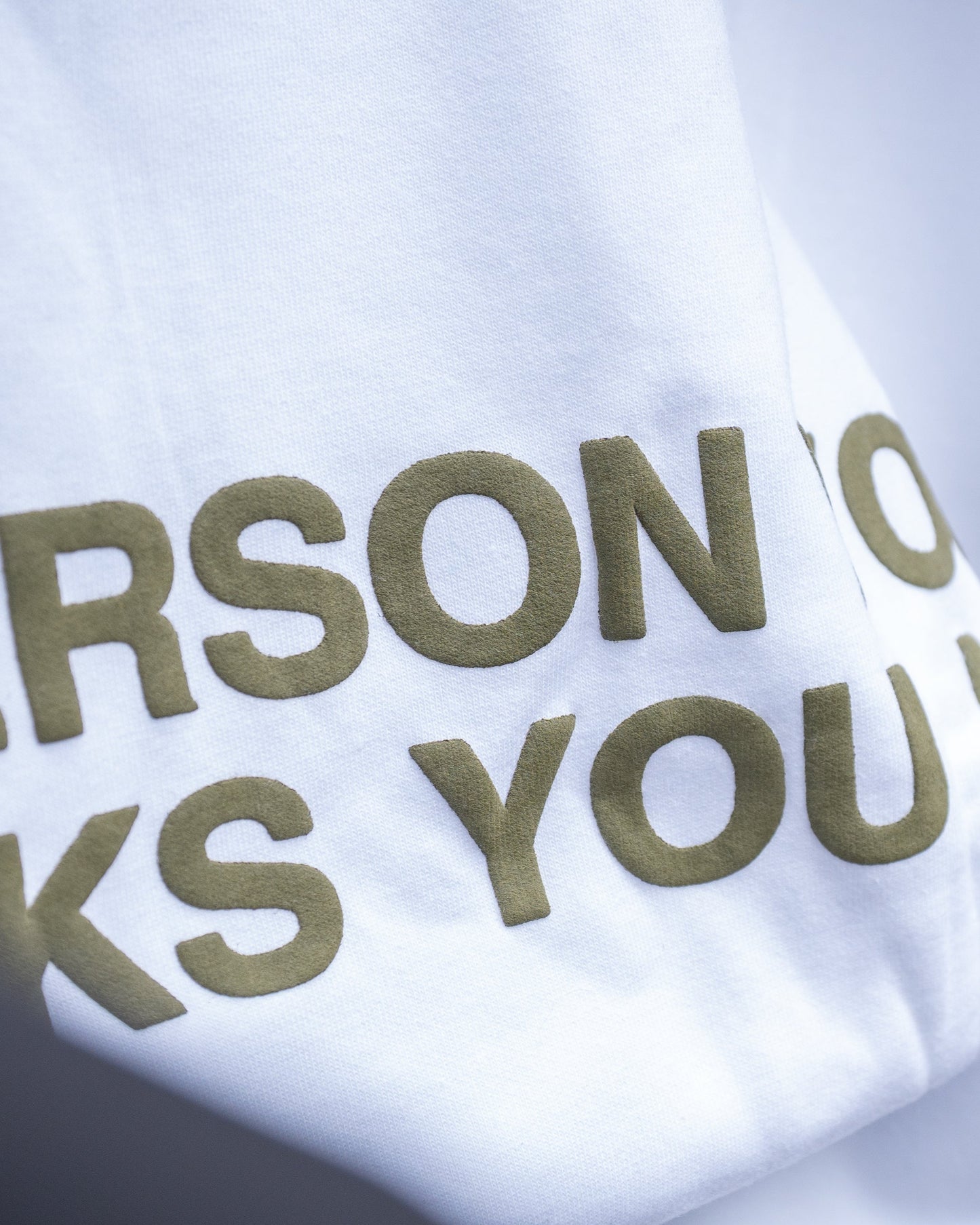 puff print slogan on white t shirt
