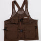 A brown utility dog training vest with multiple front pockets, adjustable shoulder straps, and a front zipper, laid flat on a white background.