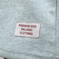 Gray fabric with a label reading 'Premium Dog Walking Clothing' on a gray background