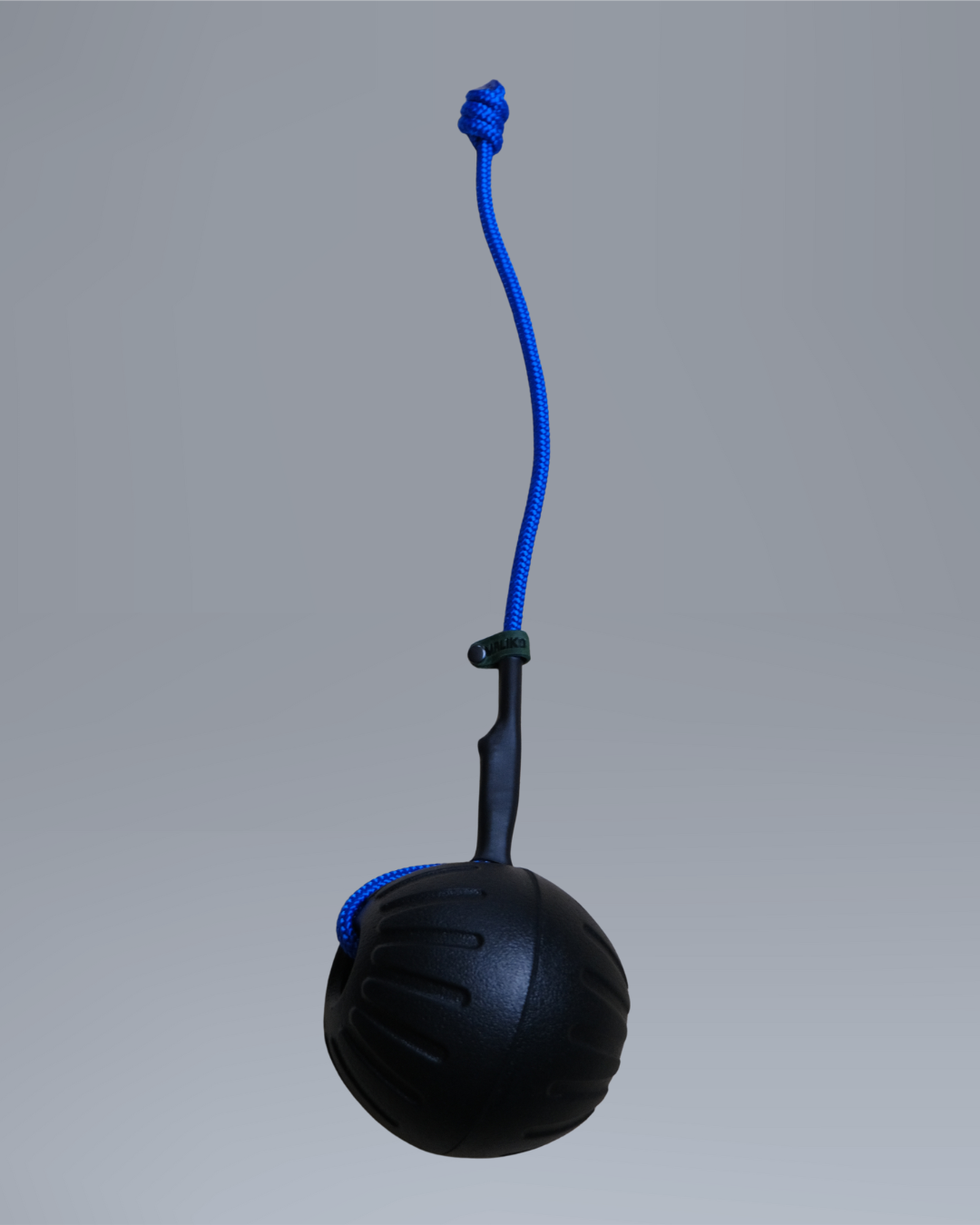 Black ball with a blue rope on a gray background